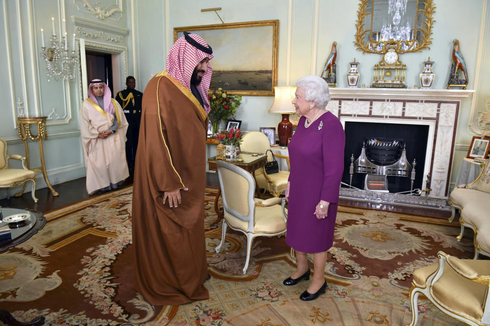FILE - In this Wednesday March 7, 2018 file photo, Queen Elizabeth II greets Saudi Arabian Crown Prince of Saudi Arabia Mohammed bin Salman, during a private audience at Buckingham Palace in London. (Dominic Lipinski/Pool via AP)