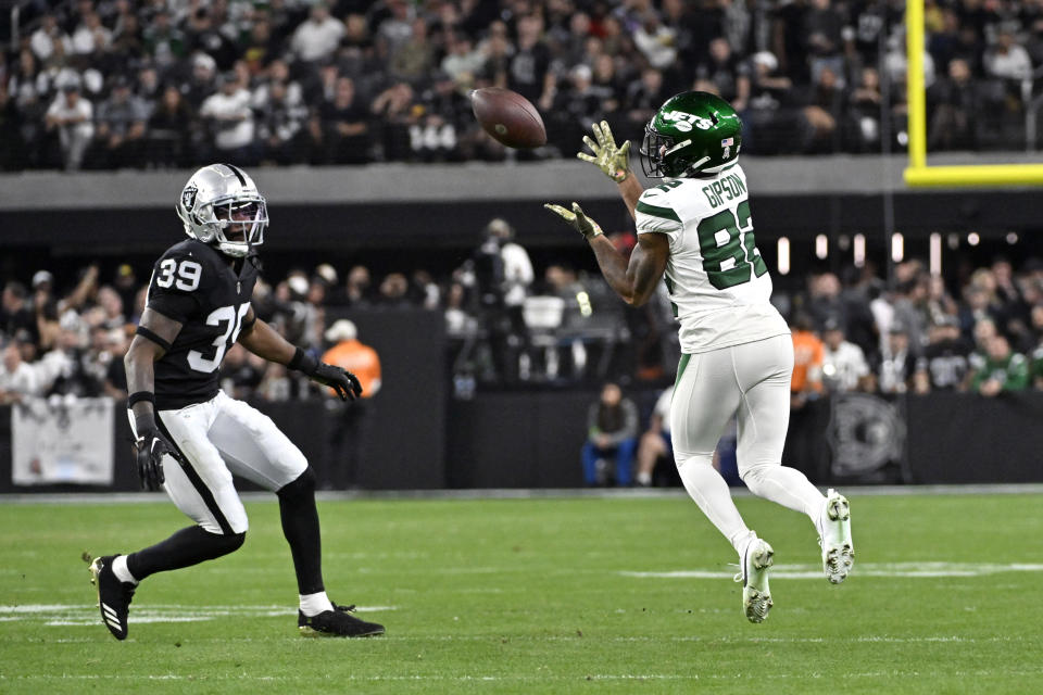 New York Jets wide receiver Xavier Gipson (82) catches a pass as Las Vegas Raiders cornerback Nate Hobbs (39) defends during the first half of an NFL football game Sunday, Nov. 12, 2023, in Las Vegas. (AP Photo/David Becker)