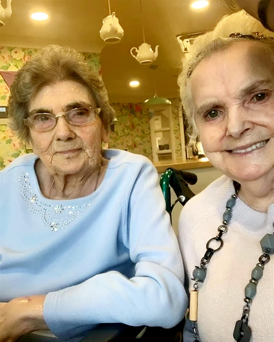 Audrey Shiston (in blue) and Margaret Moore (in brown jumper) are reunited. See SWNS story SWMDreunited; Two schoolfriends who last saw each other in 1951 have been reunited at a residential care home after more than 70 years apart. Audrey Sishton and Margaret Moore, both 86, were friends at the Belt Road School for Girls in Cannock, Staffs., during the late 1940s and early 1950s. After they had finished school, the pair went in their separate directions to marry and raise their families. Despite both still continuing to live in the Cannock area, the pair last saw each other in 1951 when they both were 15-years-old. Now, the friends have been reunited at the Littleton Lodge care home in Hednesford, Staffs., after Audrey temporarily moved whilst her house was undergoing repair work. Margaret, who has four children and seven grandchildren, had been living at the luxury care home on Bishop Street since June 2021.  Audrey immediately clocked eyes on fellow Belt Road School for Girls pupil Margaret, who had been in her class, and the pair quickly rekindled their friendship. 