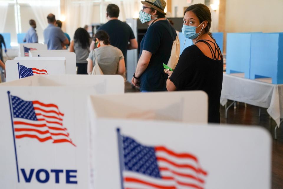 People wait in line to vote in Georgia's Primary Election on June 9, 2020, in Atlanta.