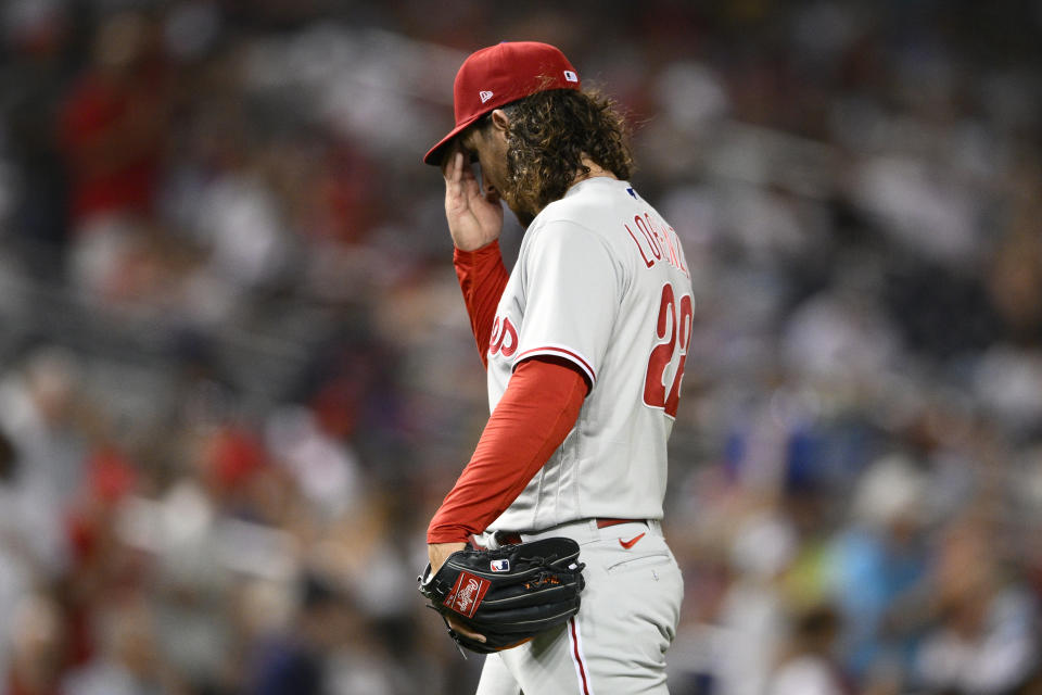 Philadelphia Phillies starting pitcher Michael Lorenzen walks to the dugout after he was pulled during the fourth inning of the team's baseball game against the Washington Nationals, Friday, Aug. 18, 2023, in Washington. (AP Photo/Nick Wass)