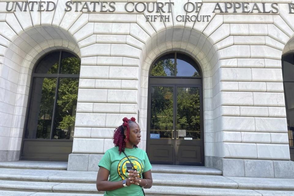 Teliah Perkins stands in front of the federal appeals court building in New Orleans, May 3, 2023, following a hearing on her lawsuit against two St. Tammany Parish, La., sheriff’s deputies stemming from her arrest in May 2020. (AP Photo/Kevin McGill, File)