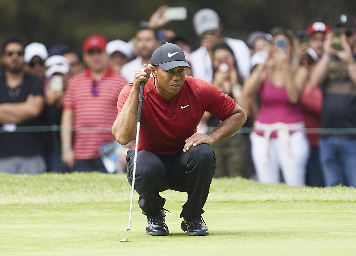 MEXICO CITY, MEXICO - FEBRUARY 24:  Tiger Woods of the United States studies his putt during the final round of World Golf Championships-Mexico Championship at on February 24, 2019 in Mexico City, Mexico. (Photo by Quality Sport Images/Getty Images)
