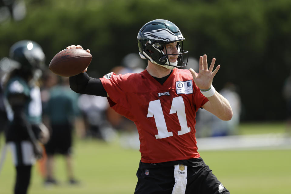 Carson Wentz continues to work his way back from an ACL tear. (AP Photo/Matt Slocum)