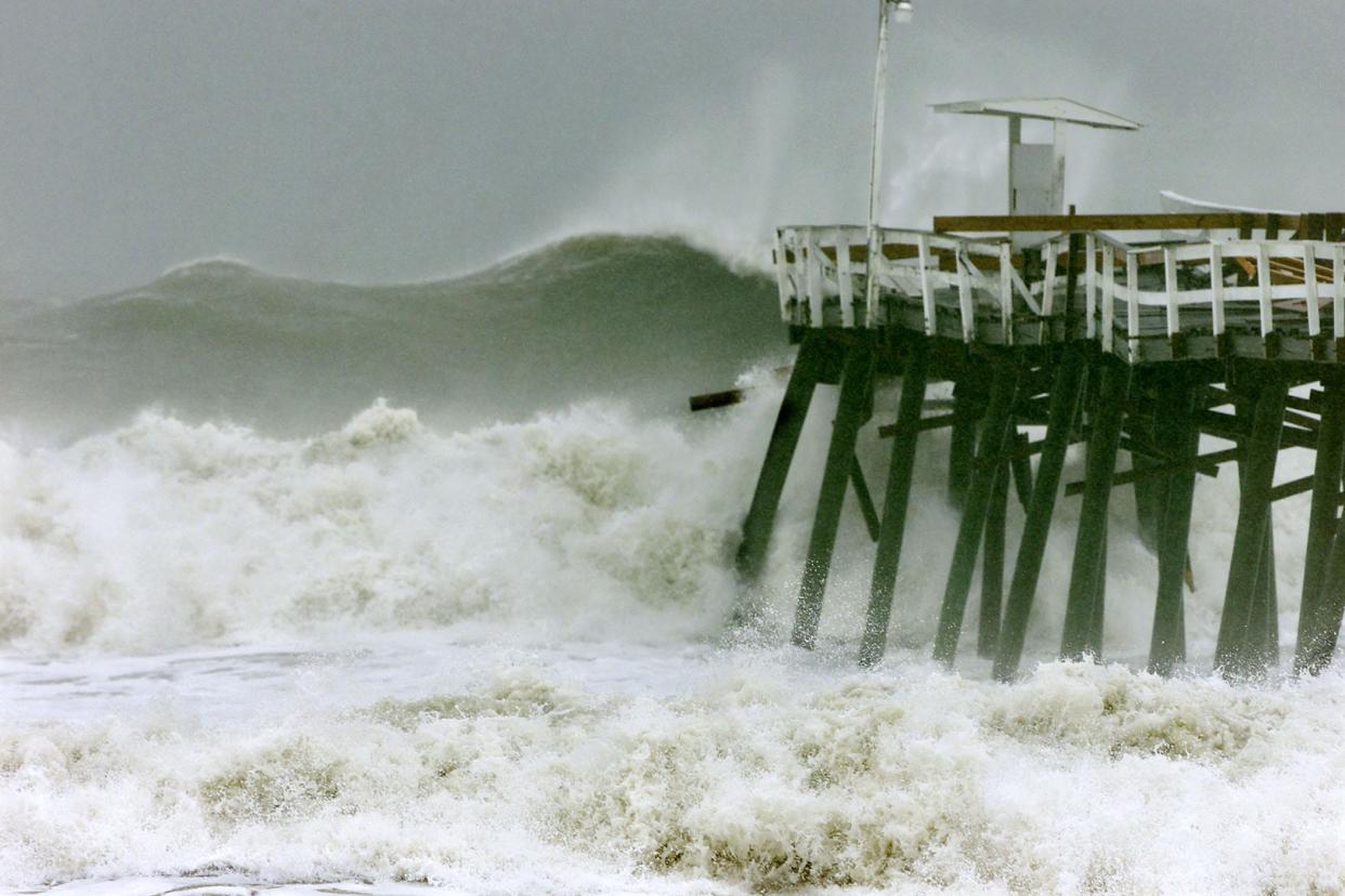 A monstrous wave spawned by Hurricane Floyd looms over the Jacksonville Beach Pier, which was largely destroyed by the1999 storm. A newer pier was built to the north after that, but it too was damaged by Hurricane Matthew in 2016 and Hurricane Irma in 2017. It recently reopened after extensive repairs.