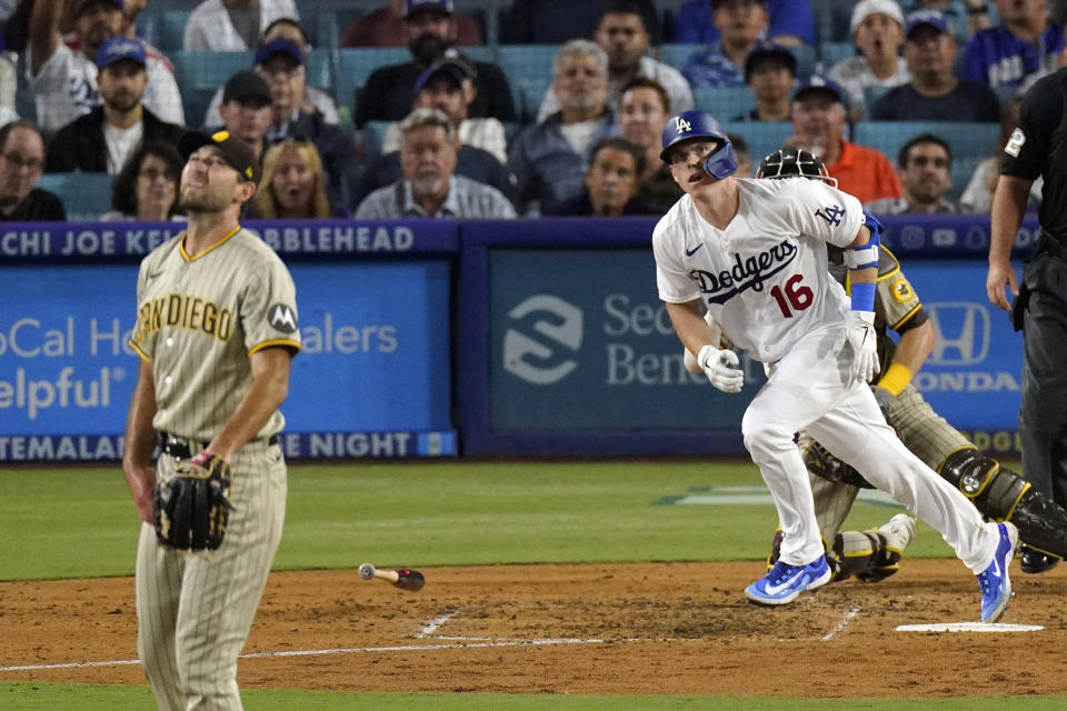 Los Angeles Dodgers' Will Smith, right, heads to first for hits a three-run home run as San Diego Padres starting pitcher Michael Wacha watches during the fourth inning of a baseball game Tuesday, Sept. 12, 2023, in Los Angeles. (AP Photo/Mark J. Terrill)