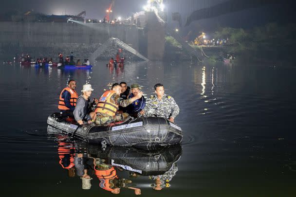 PHOTO: IIndian rescue personnel conduct search operations on Oct. 31, 2022 after a bridge across the river Machchhu collapsed in Morbi on Oct. 30. (Sam Panthaky/AFP via Getty Images)