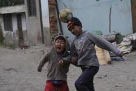 Children play soccer in the Catzuqui de Velasco, a rural area without reliable basic services like water and sewage, on the outskirts of Quito, Ecuador, Thursday, Dec. 1, 2022. Child malnutrition is chronic among Ecuador's 18 million inhabitants, hitting hardest in rural areas and among the country's Indigenous, according to Erwin Ronquillo, secretary of the government program Ecuador Grows Without Malnutrition. (AP Photo/Dolores Ochoa)