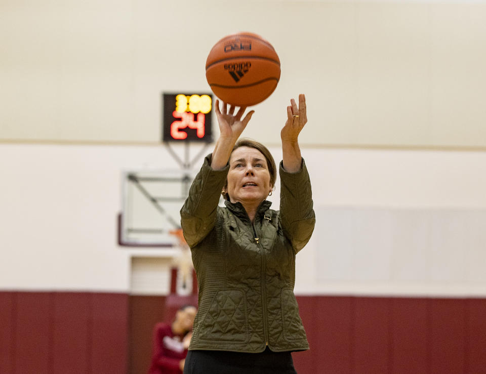 Amherst, MA - October 13: Attorney General Maura Healey takes a free throw as she visits the UMass womens basketball team. (Photo by Stan Grossfeld/The Boston Globe via Getty Images)