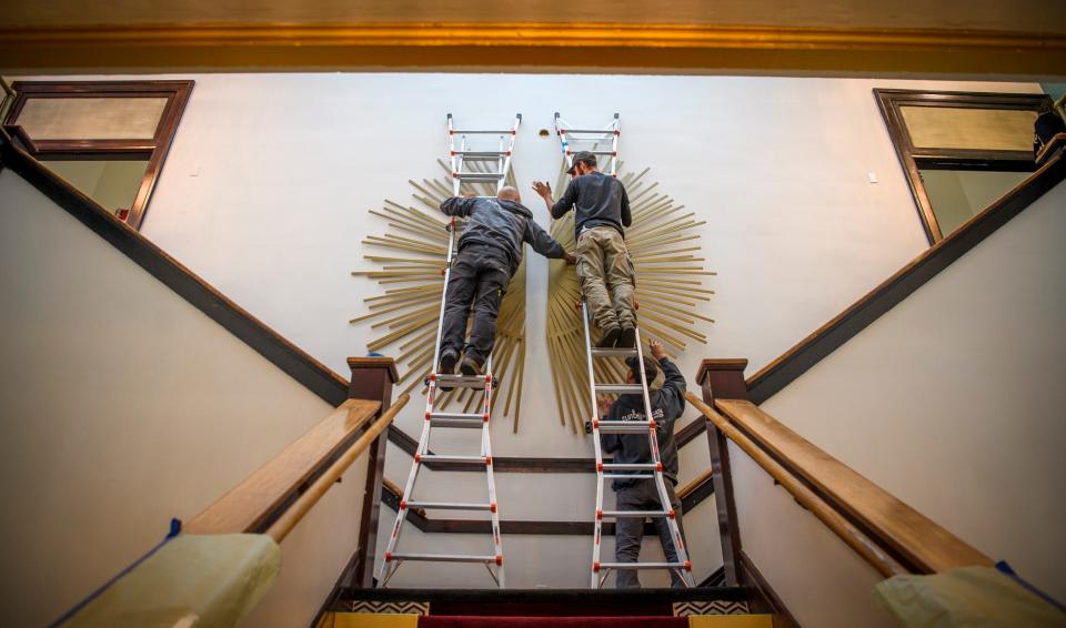 A custom made metal sunburst art piece is installed at the Waldron Arts Center on Wednesday, Oct. 12, 2022.