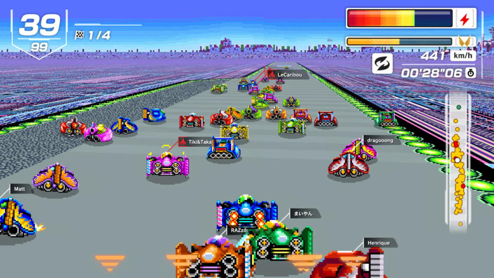 Vehicles race forward on a track.