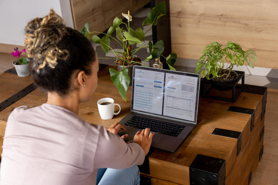 Woman looking at documents on her computer