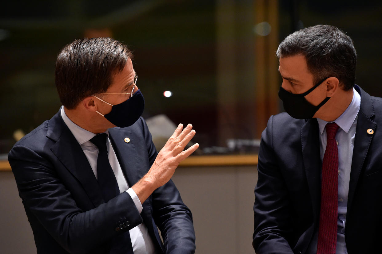 Spain's Prime Minister Pedro Sanchez and Dutch Prime Minister Mark Rutte speak during the first face-to-face EU summit since the coronavirus disease (COVID-19) outbreak, in Brussels, Belgium July 20, 2020. John Thys/Pool via REUTERS