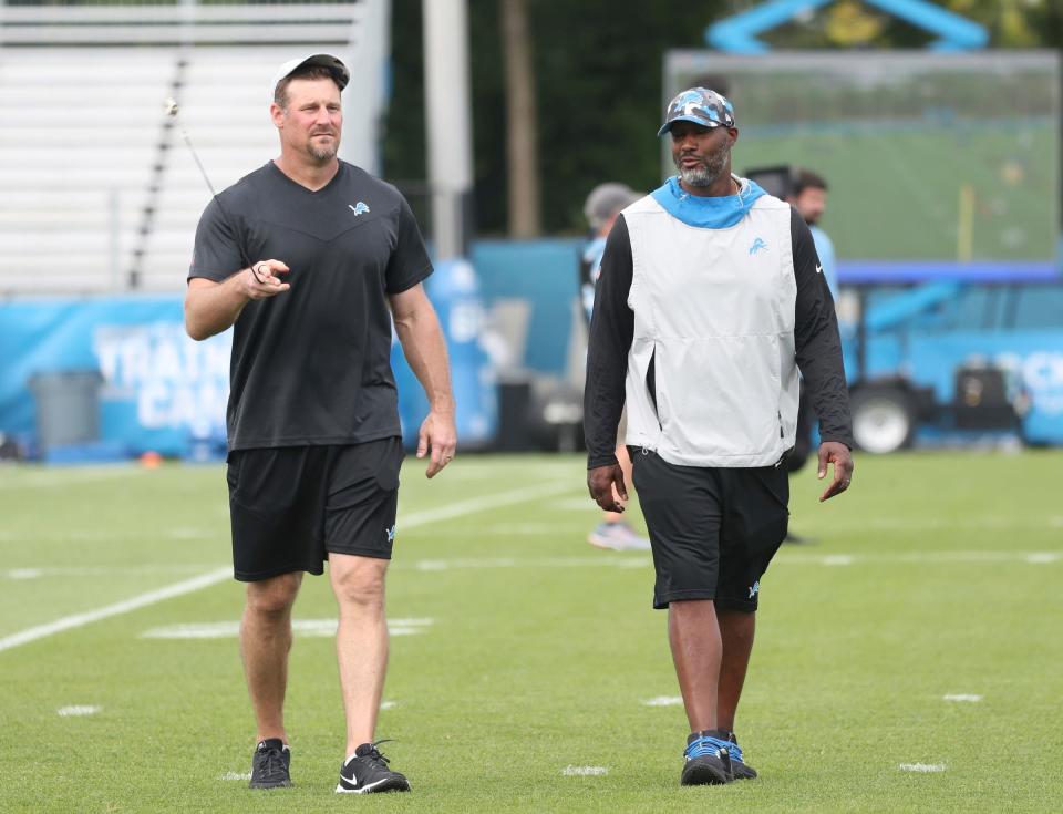 Detroit Lions GM Brad Holmes and head coach Dan Campbell walk off the field after practice Thursday, July 28, 2022 at the Allen Park practice facility. 