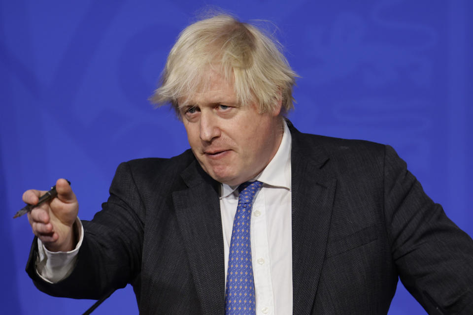 Britain's Prime Minister Boris Johnson speaks during a media briefing on COVID-19, in Downing Street, London, Wednesday Dec. 15, 2021. (Tolga Akmen/Pool via AP)