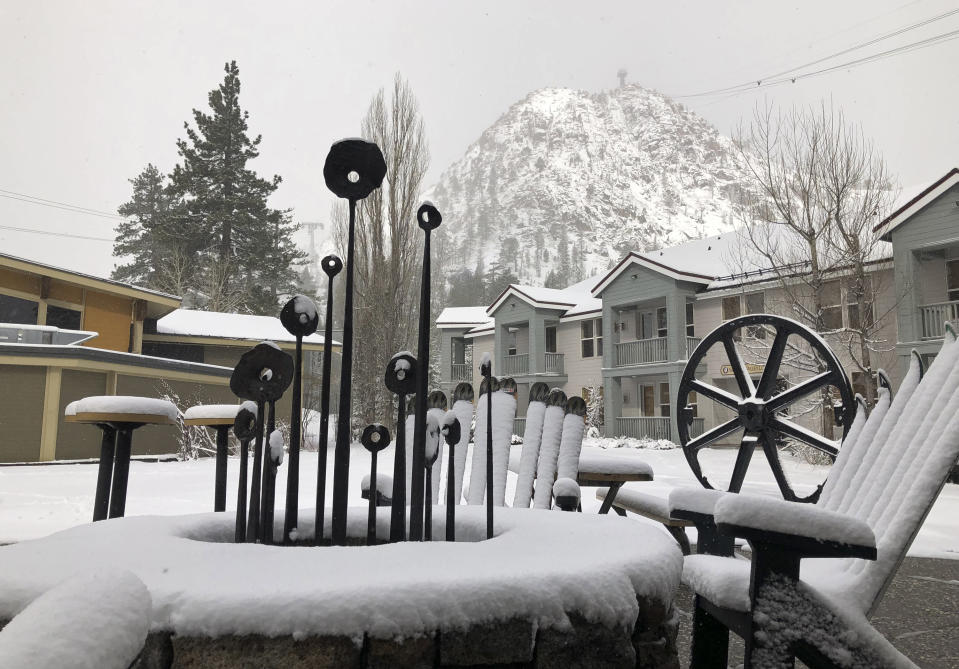 In this Tuesday, May 21, 2019, photo provided by Squaw Valley Alpine Meadows, is the snow covered Squaw Valley Ski Resort in Olympic Valley, Calif. Memorial Day may be the unofficial start of summer, but California is heading toward the holiday with rainy, windy and snowy weather. The Squaw Valley resort at Lake Tahoe reports it got 32 inches of snow over the past seven days, boosting its season total to 714 inches. Unsettled weather will continue into next week. (Ben Arnst/Squaw Valley Alpine Meadows via AP)