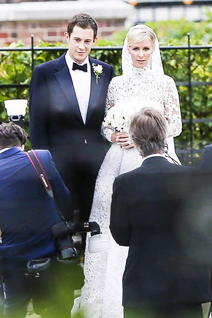 Nicky Hilton is officially a married woman! The 31-year-old socialite married James Rothschild, an heir to one of Europe's greatest banking families, at Kensington Palace in London on Friday evening. Nicky looked gorgeous, wearing a lacy long-sleeved Valentino lace wedding gown. FameFlynet FameFlynet <strong>WATCH: Ed Sheeran Surprises Couples and Becomes the Best Wedding Singer of All Time</strong> FameFlynet Nicky's older sister, Paris Hilton, served as a bridesmaid in a soft powder blue dress, while proud parents, Richard and Kathy, were on hand. Aunt Kyle Richards was also there to see her niece walk down the aisle. Splash News Celebrity wedding guests included supermodel Naomi Campbell, Chelsea Clinton and her husband, Marc Mezvinsky, and billionaire Formula One heiress Petra Stunt -- it was actually at Petra's 2011 wedding to James Stunt where the couple met. As for post-nuptial entertainment, the couple will be serenaded by none other than Lionel Richie. Check out Nicky's walk down the aisle. Prior to the big day, Nicky and James held a pre-wedding dinner on Thursday night at Spencer House in St. James's for close friends and family. Check out this super-cute snap of the couple smooching before the ceremony. "So happy that my sister found the man of her dreams," Paris Instagrammed. "They make the perfect couple! So excited for their wedding today! #MrsRothschild." Friday's nuptials marks Nicky's second marriage. Nicky married businessman Todd Meister in Las Vegas in August 2004, but it was annulled just three months later. She's been engaged to James since August 2014, and they've been dating since 2011. <strong>WATCH: Ashton Kutcher and Mila Kunis Wed in Secret Ceremony</strong> Check out 9 celebrity weddings we can't wait for in the video below!