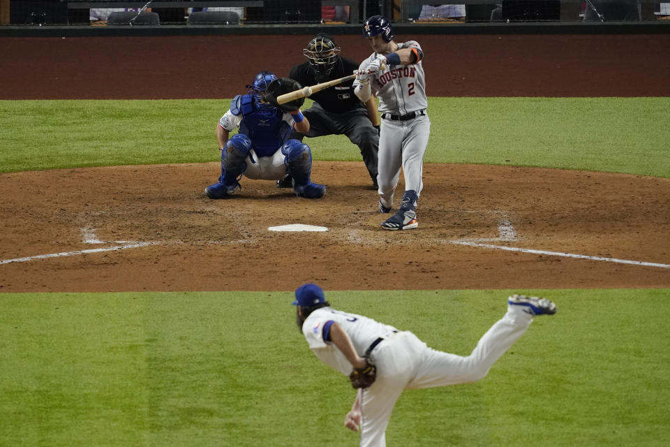 Houston Astros' Alex Bregman hits a double off Texas Rangers starting pitcher Lance Lynn during the sixth inning of a baseball game in Arlington, Texas, Thursday, Sept. 24, 2020. (AP Photo/Tony Gutierrez)