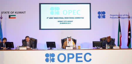 Kuwait Oil Minister Ali Al-Omair gives his opening speech during OPEC 2nd Joint Ministerial Monitoring Committee meeting as Russian Energy Minister Alexander Novak and OPEC Secretary General Mohammad Barkindo attend the meeting in Kuwait City, Kuwait, March 26, 2017. REUTERS/Stephanie McGehee