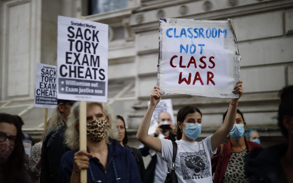 Around 100 protesters marched on Whitehall to demand a Government U-turn on exams - AFP