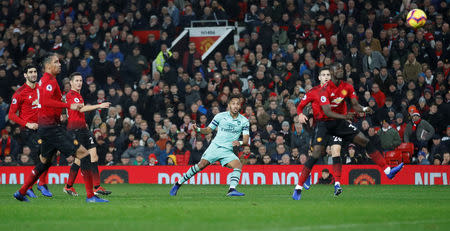 Soccer Football - Premier League - Manchester United v Arsenal - Old Trafford, Manchester, Britain - December 5, 2018 Arsenal's Pierre-Emerick Aubameyang shoots at goal as Manchester United's Eric Bailly attempts to block Action Images via Reuters/Carl Recine