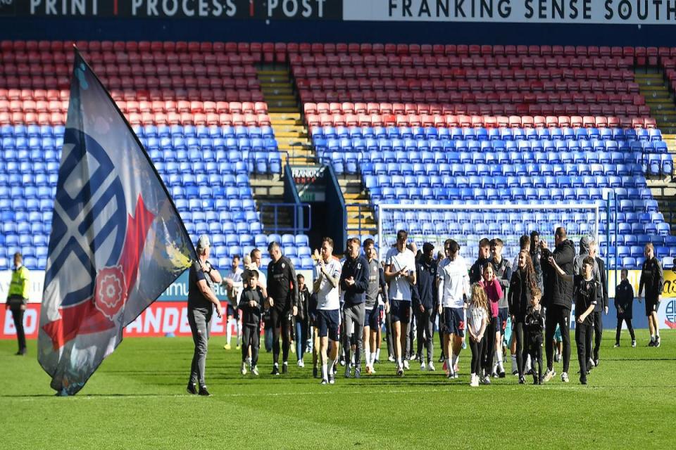 Ian Evatt's players walk off the pitch on Saturday with the play-offs beckoning <i>(Image: Camerasport)</i>