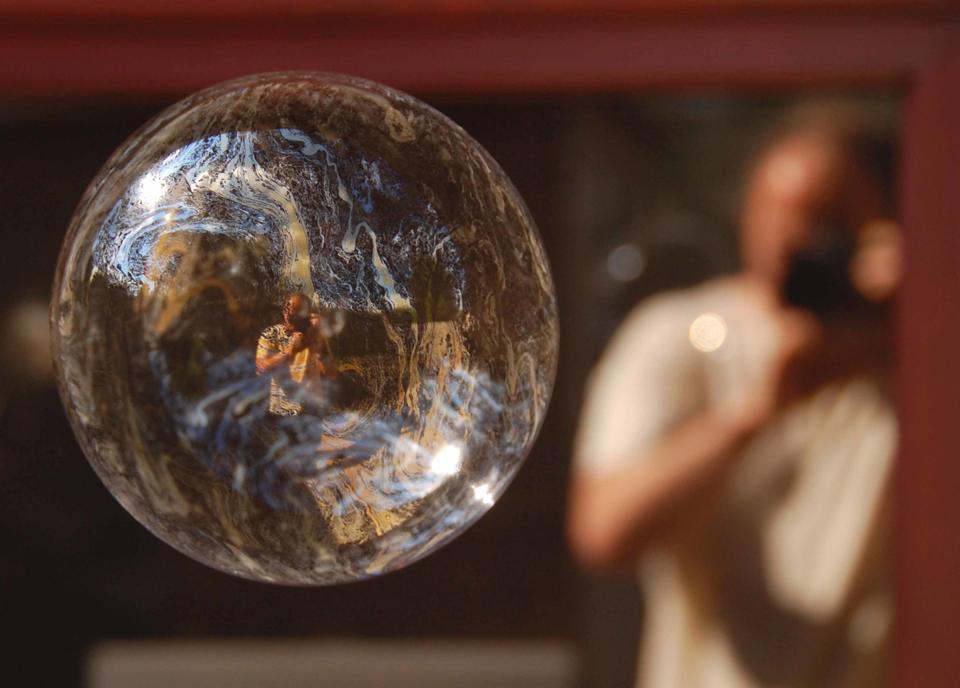 Self-portrait through a bubble reflection. 