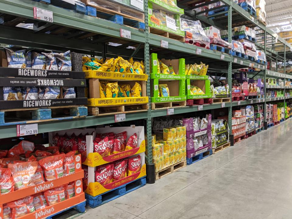 Chips and rice-cake packages in grocery store aisle
