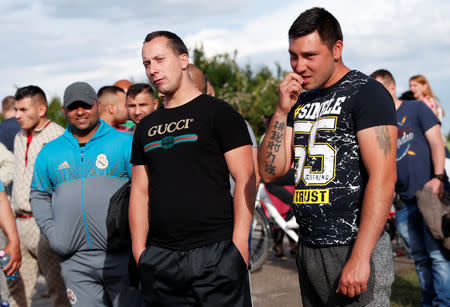 Roma people gather on the outskirts of the town to commemorate the killings of Roma people by right-wing militants in 2009, in Torokszentmiklos, Hungary, May 21, 2019. REUTERS/Bernadett Szabo