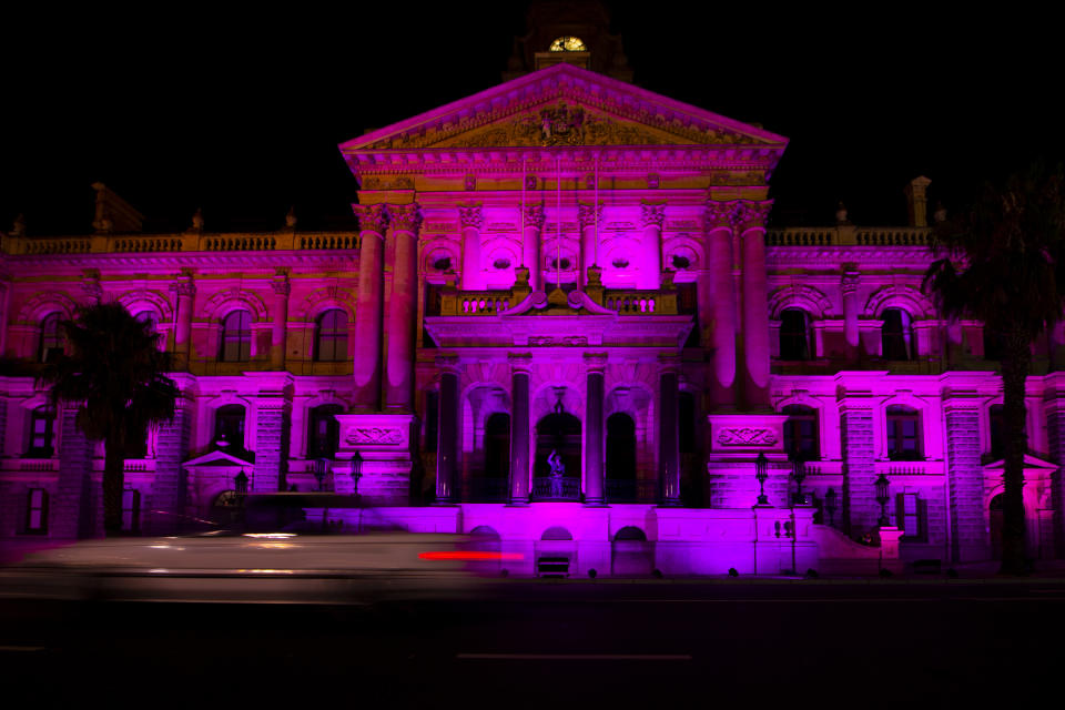 The City Hall in Cape Town, South Africa, is lit up in purple on Sunday, Dec. 26, 2021, in memory of Anglican Archbishop Desmond Tutu. South Africa's president says Tutu, South Africa's Nobel Peace Prize-winning activist for racial justice and LGBT rights and the retired Anglican Archbishop of Cape Town, has died at the age of 90. (AP Photo)