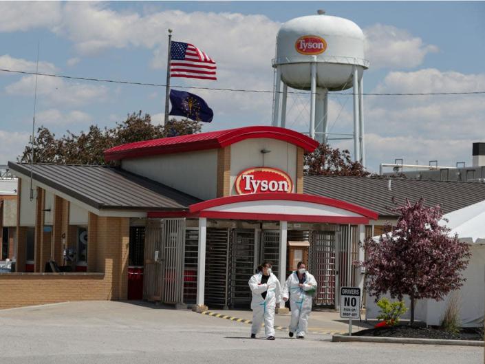 Workers leave the Tyson Foods pork processing plant in Logansport, Indiana, on May 7, 2020 (Michael Conroy_AP Photo