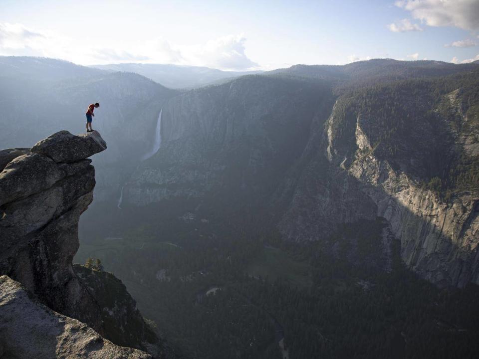 Honnold peers over the edge of Glacier Point in Yosemite national park (National Geographic/Jimmy Chin)