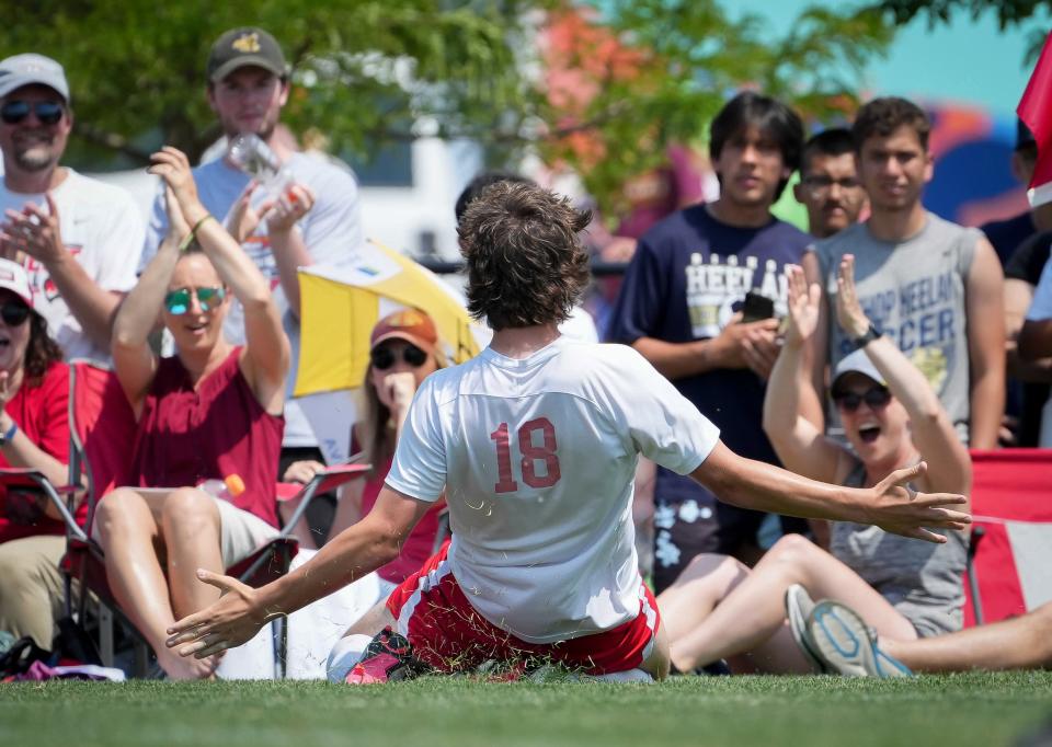 Gilbert’s Connor Rash (18) celebrates with fans after scoring a goal against Davenport Assumption during the Class 2A boys state soccer finals on Saturday, June 3, 2023, at the Cownie Soccer Park in Des Moines.
