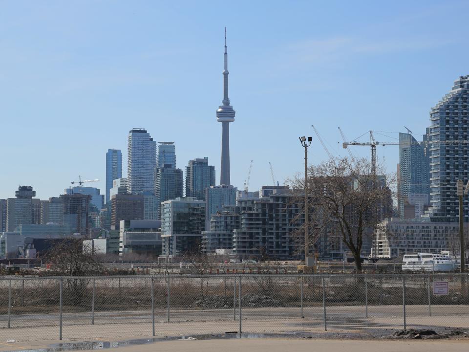FILE PHOTO: The downtown skyline and CN Tower are seen past the eastern waterfront area envisioned by Alphabet Inc's Sidewalk Labs as a new technical hub in the Port Lands district of Toronto, Ontario, Canada March 29, 2019. REUTERS/Chris Helgren/File Photo