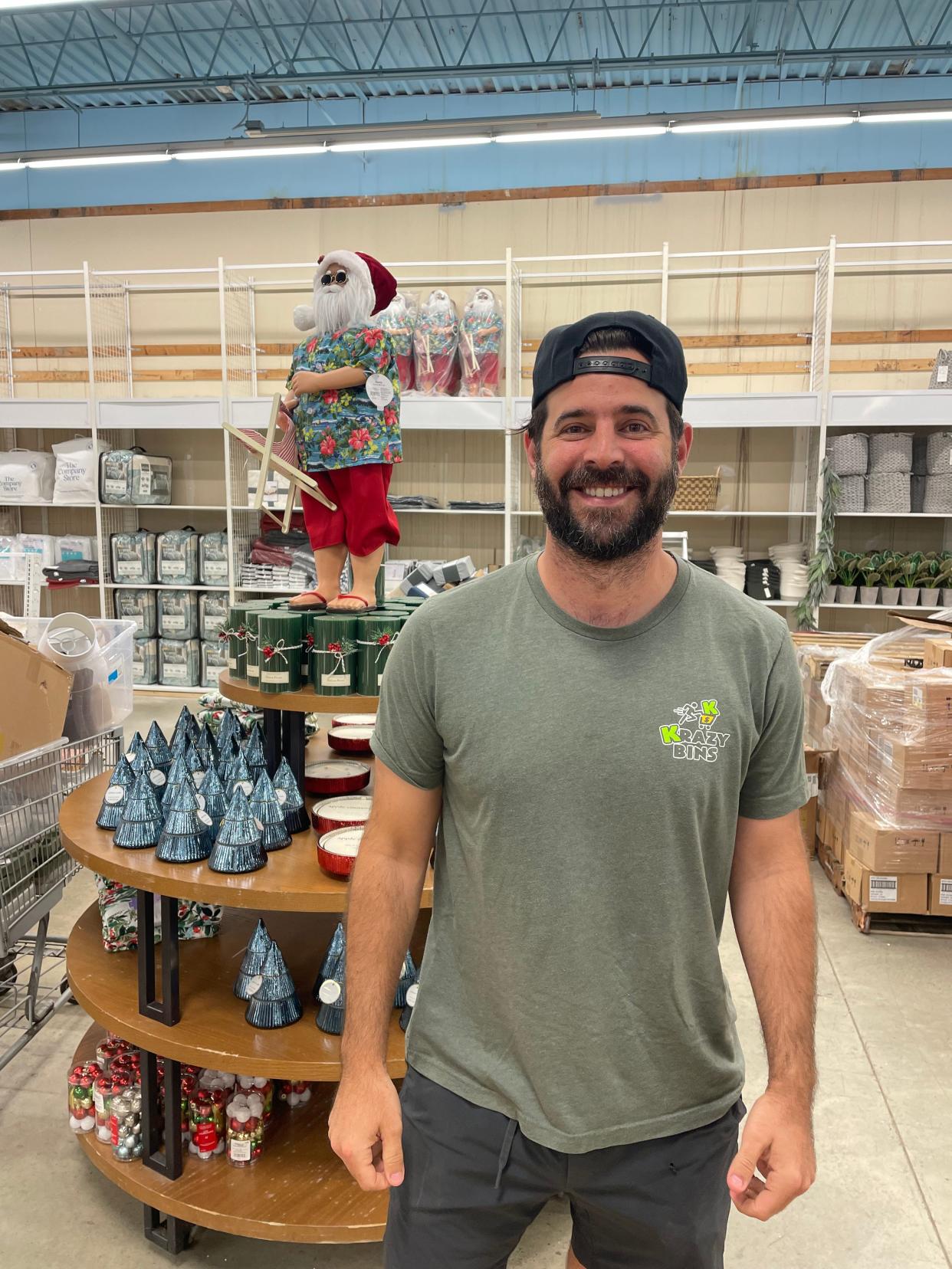 Krazy Racks owner Noah Leavitt poses in front of a display in the new Twinsburg store.