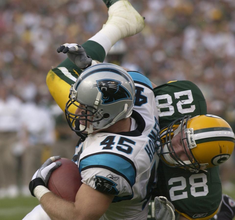 Green Bay's Matt Bowen takes down Carolina's Brad Hoover in their game against Sunday, Sept, 29, 2002.