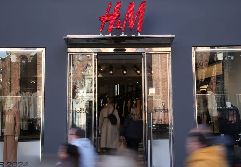 FILE PHOTO: People walk past a branch of fashion retailer H&M in Copenhagen
