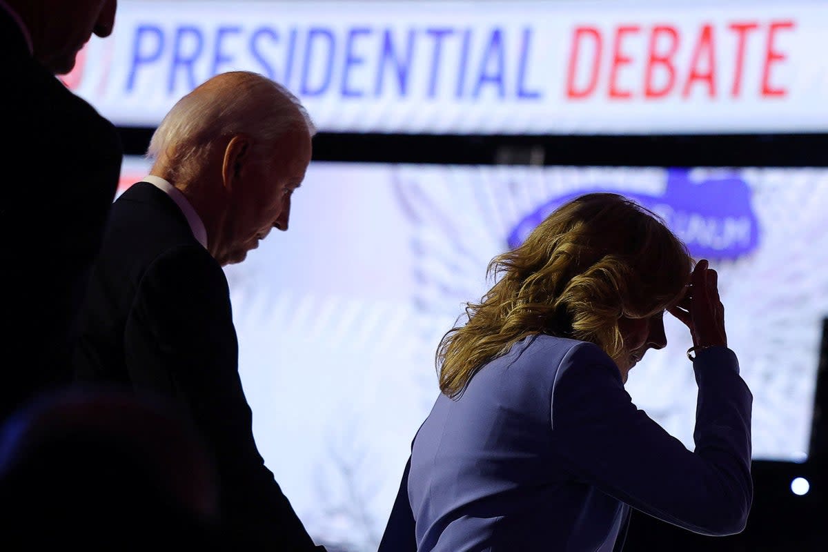 Joe Biden and First Lady Jill Biden leave the CNN presidential debate stage on June 27 (REUTERS)