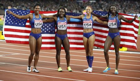 Athletics - World Athletics Championships – women’s 4 x 100 meters relay final – London Stadium, London, Britain – August 12, 2017 – Aaliyah Brown, Allyson Felix, Morolake Akinosun and Tori Bowie of the U.S. celebrate winning the gold medal. REUTERS/Phil Noble