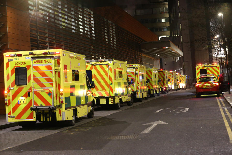 Ambulances queued outside the Royal London Hospital, in London on Tuesday December 29, 2020. 