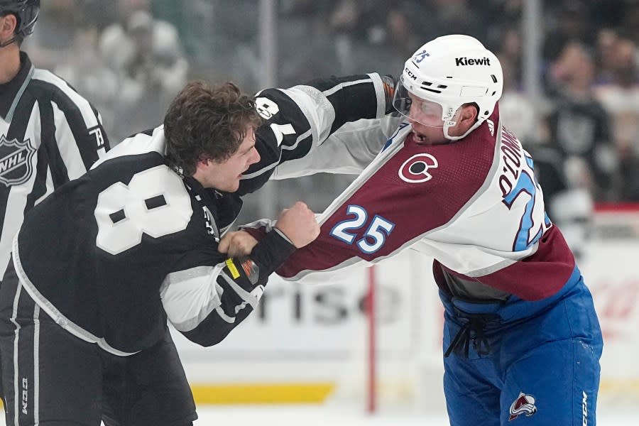 Los Angeles Kings right wing Alex Laferriere, left, and Colorado Avalanche right wing Logan O’Connor fight during the second period of an NHL hockey game Wednesday, Oct. 11, 2023, in Los Angeles. (AP Photo/Mark J. Terrill)