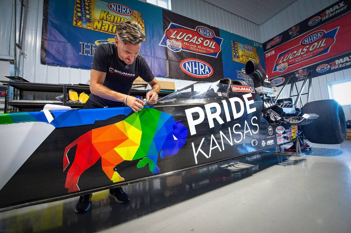 Drag racer Travis Shumake will make history at Heartland Motorsports Park in Topeka this weekend as the first openly gay driver in an NHRA national event. Visit Topeka and Pride Kansas are sponsoring Shumake’s alcohol-fueled dragster, which he decorated in this rainbow motif Tuesday in Johnson County. 