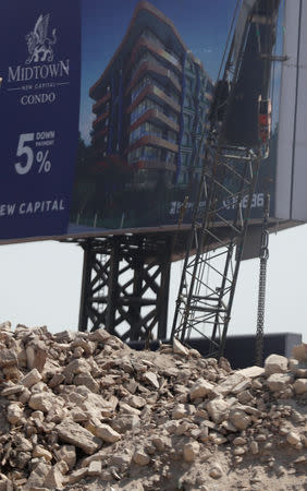 Debris are seen behind Egyptian Radio and Television Union (ERTU) headquarters in the so-called "Maspero Triangle" in the capital of Cairo, Egypt, September 13, 2018. REUTERS/Amr Abdallah Dalsh