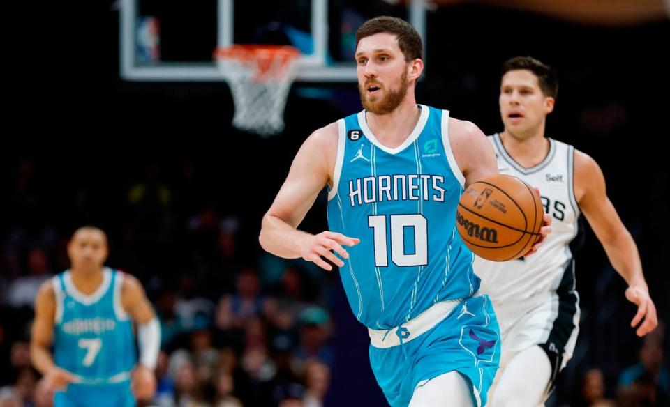 Charlotte Hornets guard Svi Mykhailiuk (10) pushes the ball up against the San Antonio Spurs during the second half at Spectrum Center in Charlotte, North Carolina on Feb. 15, 2023.