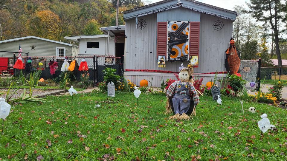 In this file photo, a house along Pine Street in Garrett had lots of graves, ghosts and even a friendly scarecrow.