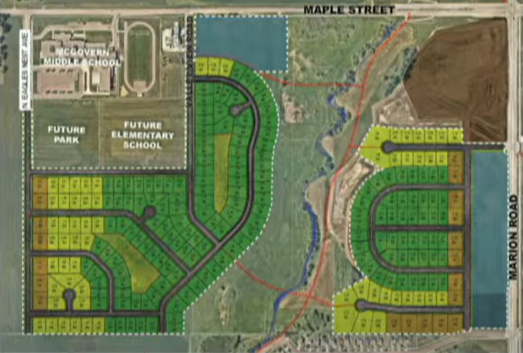 Pictured is the map of future developments on the northwest side of Sioux Falls with George McGovern Middle School at the top left corner to the northwest, situated just north of sites for a future park and a future elementary school. A walking bridge outlined in red will connect neighborhoods and create pathways for students to get to school by crossing a drainage way. The map as shown to the school board in a meeting on Sept. 7, 2022.