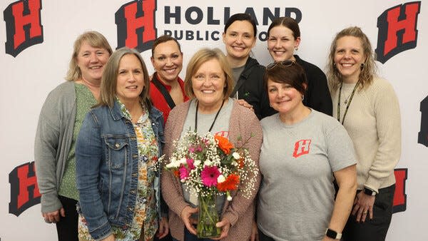 Lisa Gort (center) stands with other nurses in the Holland Hospital School Nurse Program.