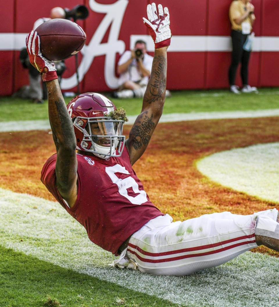 FILE - Alabama's DeVonta Smith (6) reacts after his third-quarter touchdown reception against Mississippi during an NCAA college football game in Tuscaloosa, Ala., in this Saturday, Sept. 28, 2019, file photo. DeVonta Smith is The Associated Press college football player of the year, becoming the first wide receiver to win the award since it was established in 1998, Tuesday, Dec. 29, 2020. (Bruce Newman/The Oxford Eagle via AP)