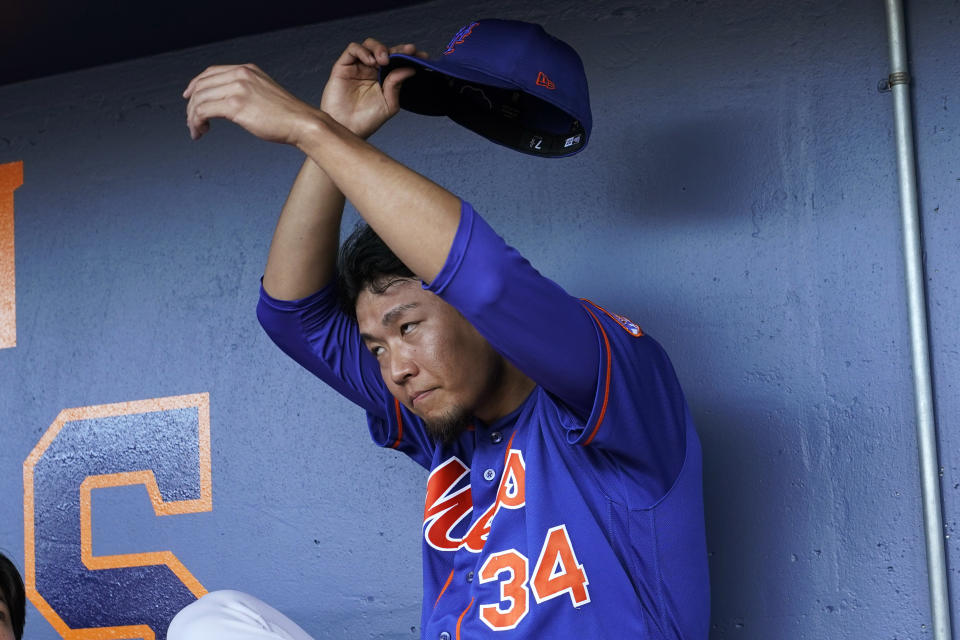 New York Mets starting pitcher Kodai Senga sits in the dugout after pitching during the first inning of the team's spring training baseball game against the Washington Nationals, Thursday, March 16, 2023, in West Palm Beach, Fla. (AP Photo/Lynne Sladky)