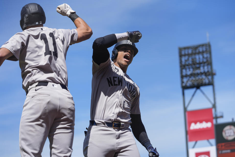 New York Yankees' Juan Soto, right, celebrates with Anthony Volpe after hitting a two-run home run against the San Francisco Giants during the ninth inning of a baseball game, Sunday, June 2, 2024, in San Francisco. (AP Photo/Godofredo A. Vásquez)